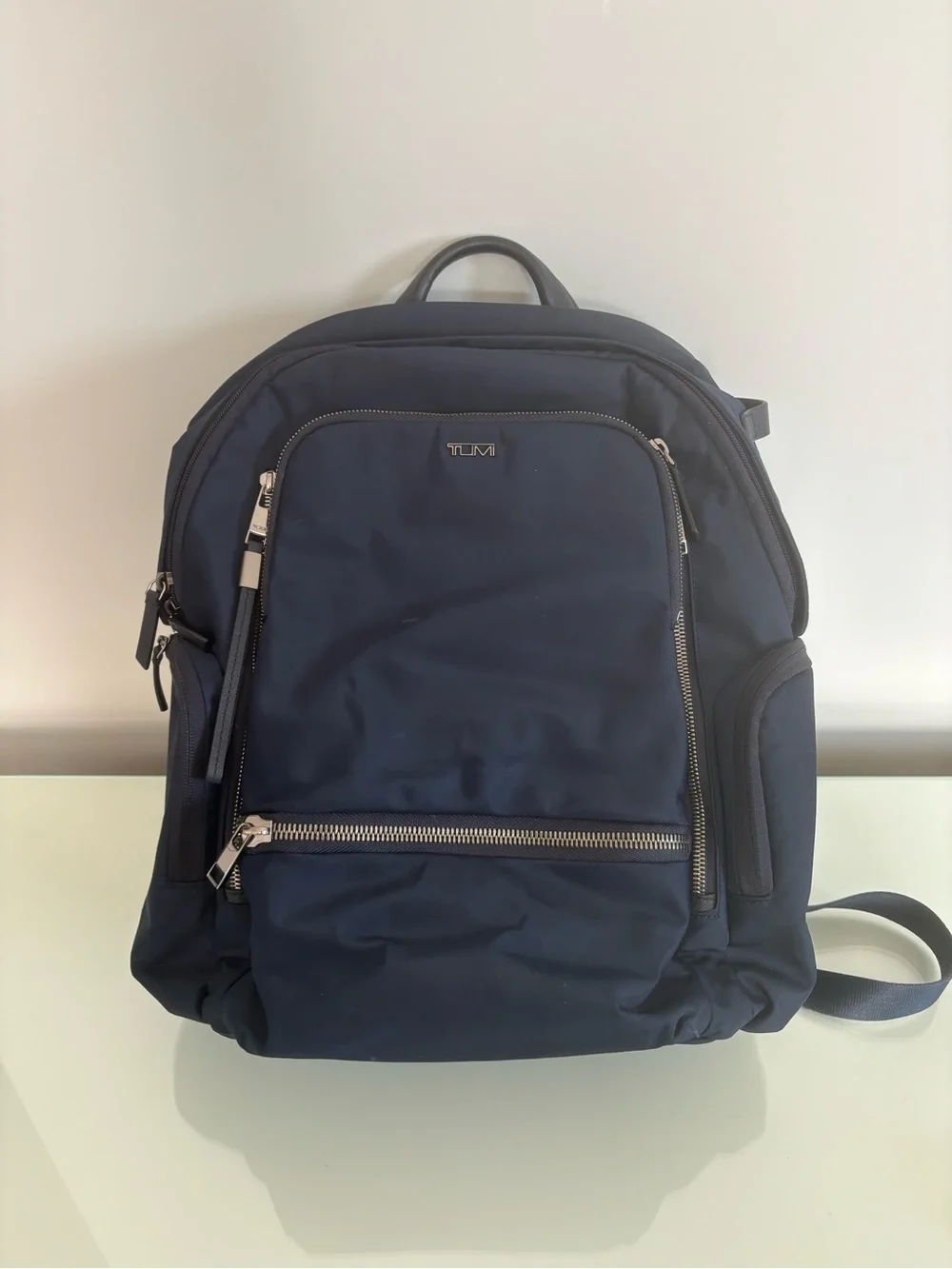 Tumi Navy Blue Men's Backpack with Silver Hardware
